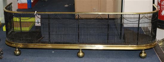 A Victorian brass mounted fender